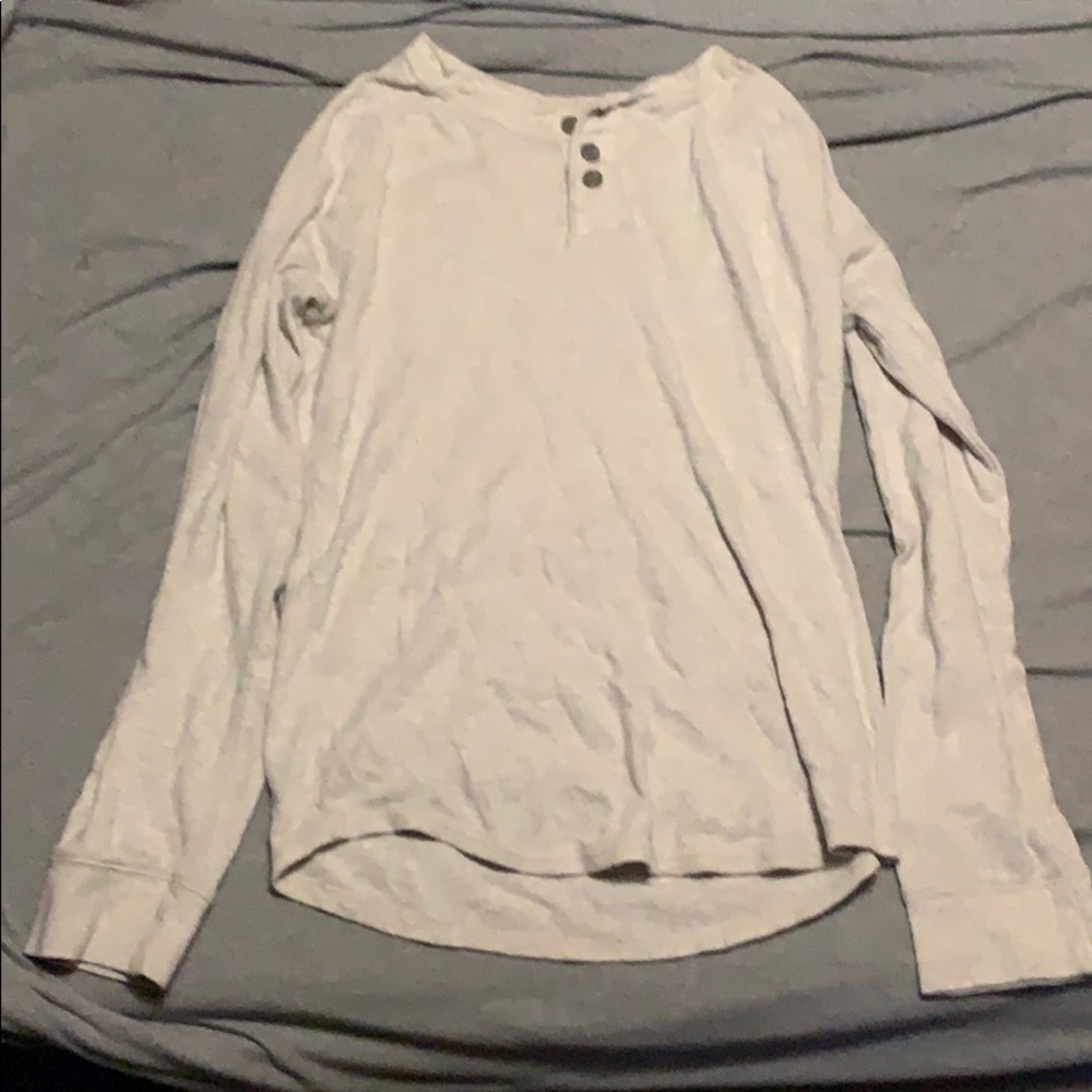 Cream colored pullover sweater.